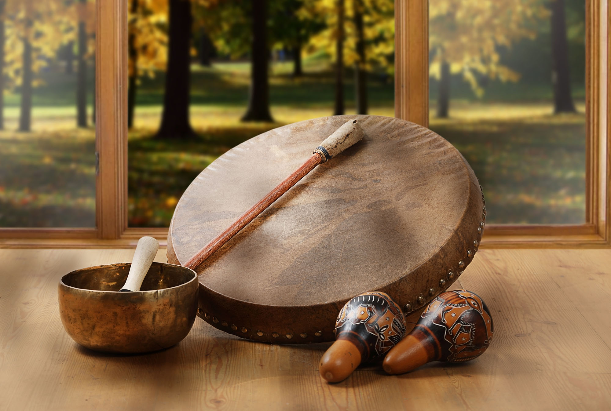 A still life of the shamanic drum, Tibetan singing bowls and mar